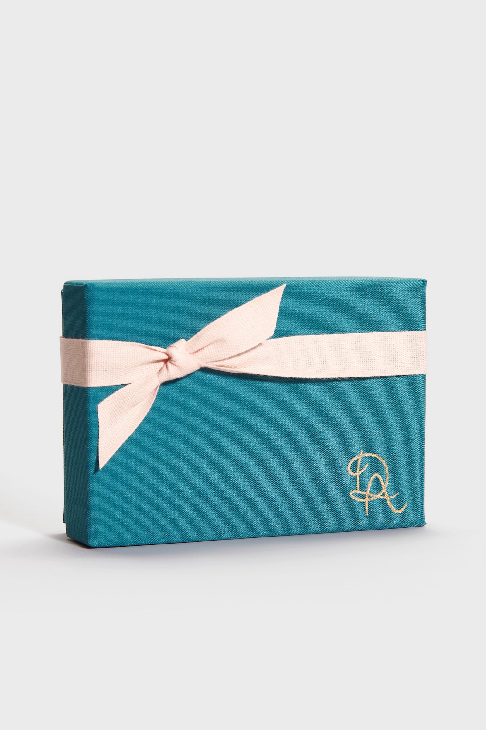 Merry Gift Tags: Classic, high-end gift box with embossed initials, wrapped in teal with a pink ribbon. Effortless elegance for a fun, festive touch.