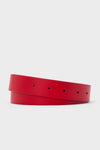A Cesoli coiled red leather belt with a textured pebble-grain finish and multiple holes, crafted from Italian leather, is displayed.