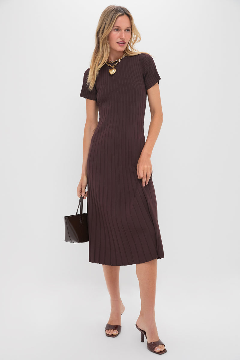 Model showcases the classic Root Brown Posseni Heels with a sleek, effortless mule design, featuring a square toe and angled heel, paired with a chic midi dress.