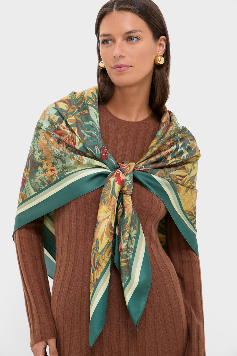 Model wearing the Forest Toile Large Scarf, a classic, high-end accessory with an effortless botanical print, paired with chunky gold-tone earrings for a fun, chic look.