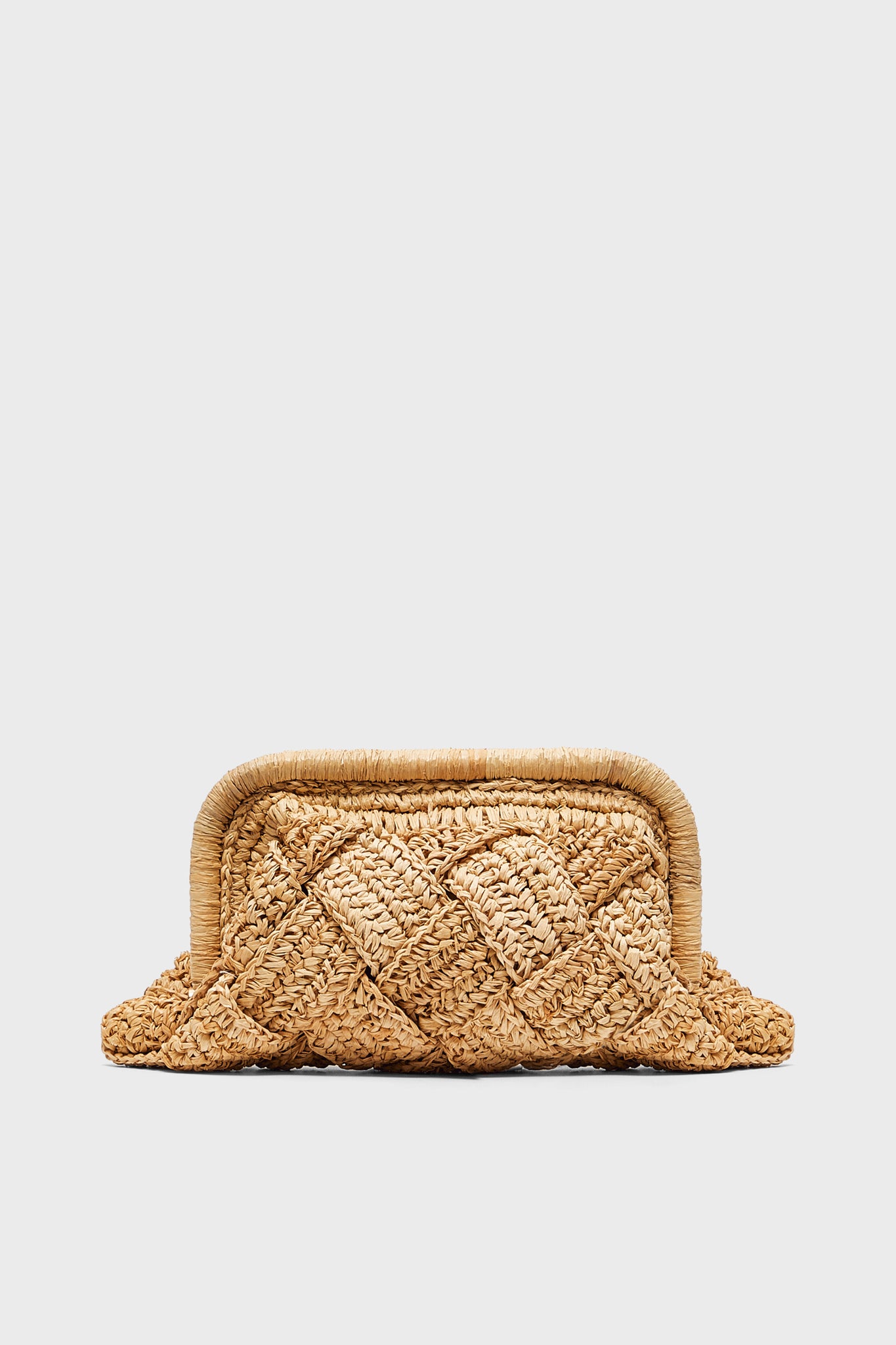 The BTB rectangular woven straw clutch features a textured braided raffia design with rounded edges—perfect for adding boho-chic flair to your beach style.