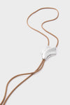 High Polish Silver Lydia Bolo Tie Necklace with adjustable silver slider on a light tan cord; a classic, effortless accessory for fun, high-end styling.