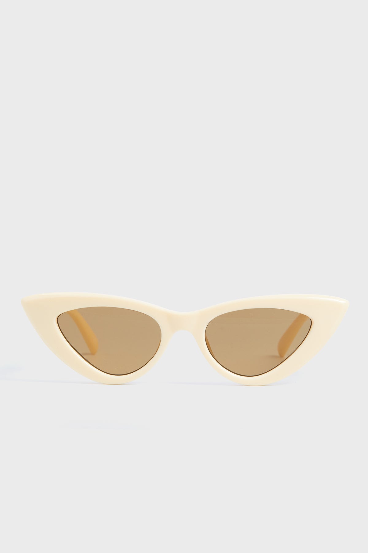 Le Specs cat-eye sunglasses in beige with brown tinted lenses—ideal for women wanting modern, stylish eyewear.