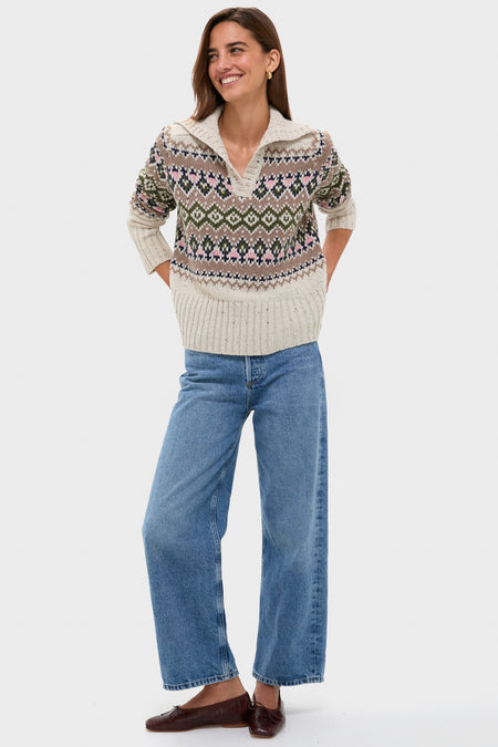 Woman in a classic, eggshell Fair Isle Edna Sweater with spread collar and high-waisted jeans, embodying an effortless, high-end, and fun style.