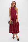 Ruby Textured Floral Melina Maxi Dress exudes classic elegance with its high-neck design and floral texture, effortlessly paired with a woven clutch and heels for a high-end look.