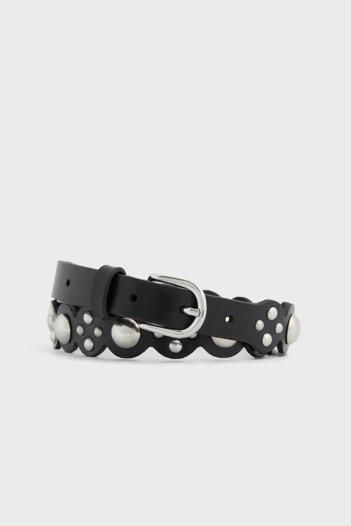 The Isabel Marant black calfskin leather belt features scalloped edges, silver studs, and a silver buckle—an iconic accessory from the brand.