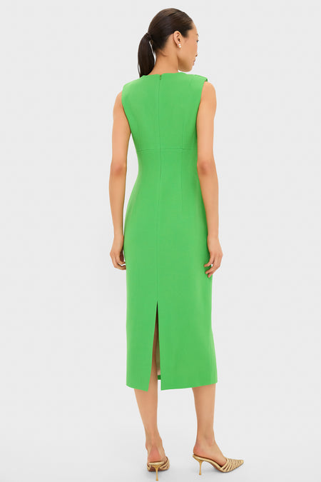 Woman in a classic, bright-green Fresh Green Yuri Gown with a sleek silhouette, dramatic neckline drapery, and strappy heels, embodying an effortless, fun, high-end style.