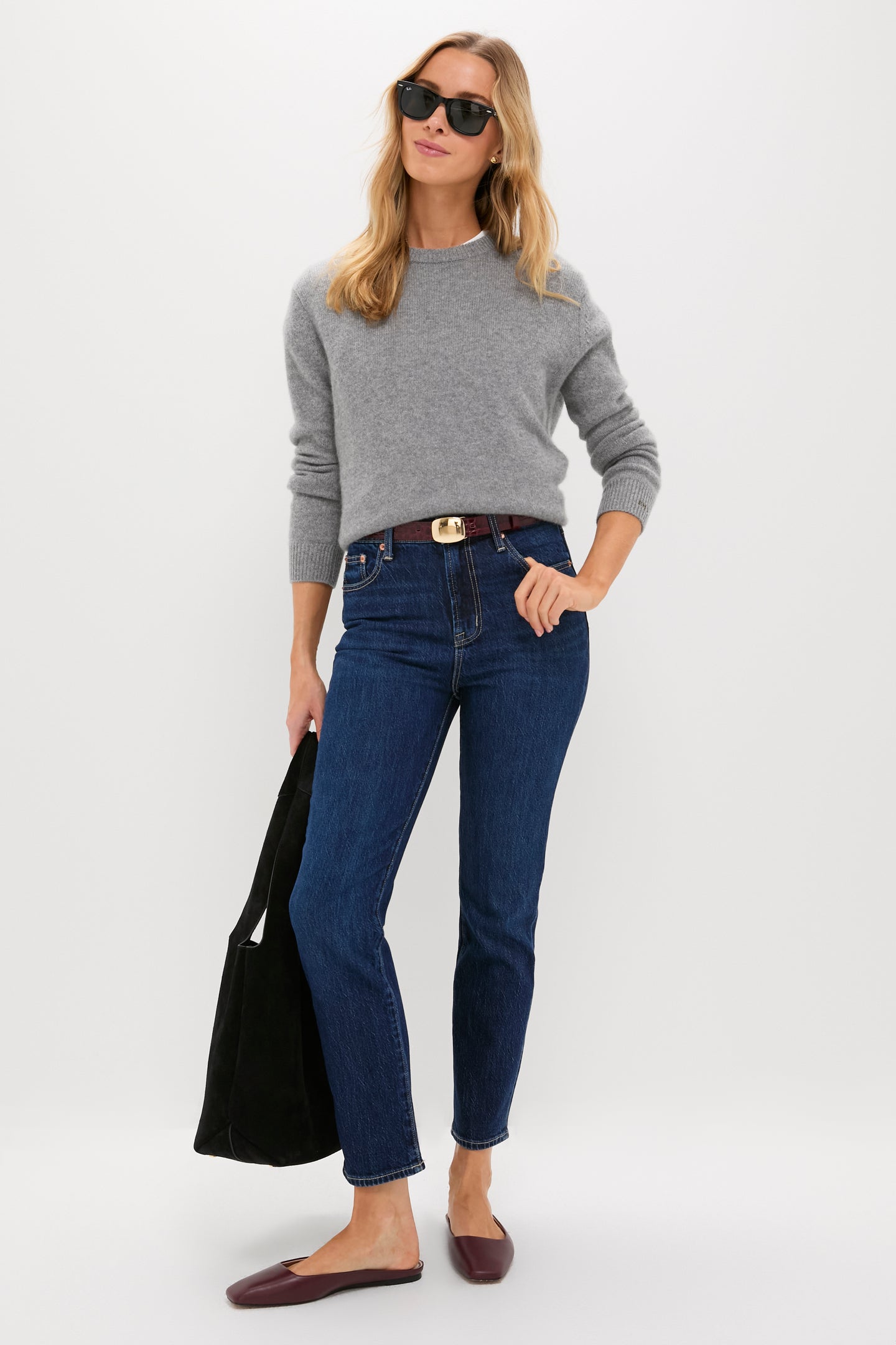 Woman effortlessly styled with a classic Merlot Jacob Croco Belt, featuring a sleek gold buckle and croc-embossed leather, adding high-end sophistication to her casual look.