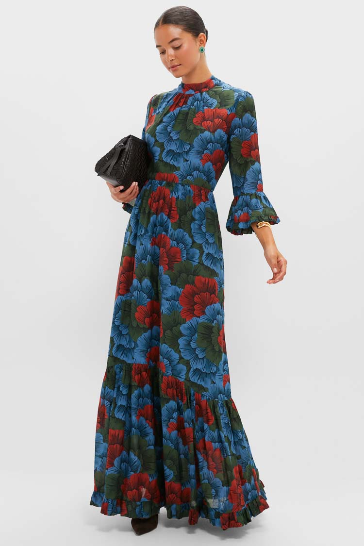 Model wearing a classic, floral maxi dress, accessorized with Malachite Emery Studs for an effortless, high-end look, exuding fun and confidence.