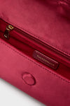 Cranberry Satin Gabrielle Clutch interior with classic gold zip pocket, leather Tuckernuck label, and effortless magnetic snap closure, combining high-end flair and fun functionality.