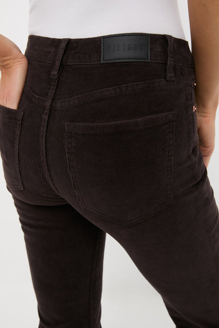 Rear view of Mocha Kinsley Mid Rise Ultra Flare Cord pants by PISTOLA, showcasing classic, effortless design with back pockets and luxurious leather patch detail.
