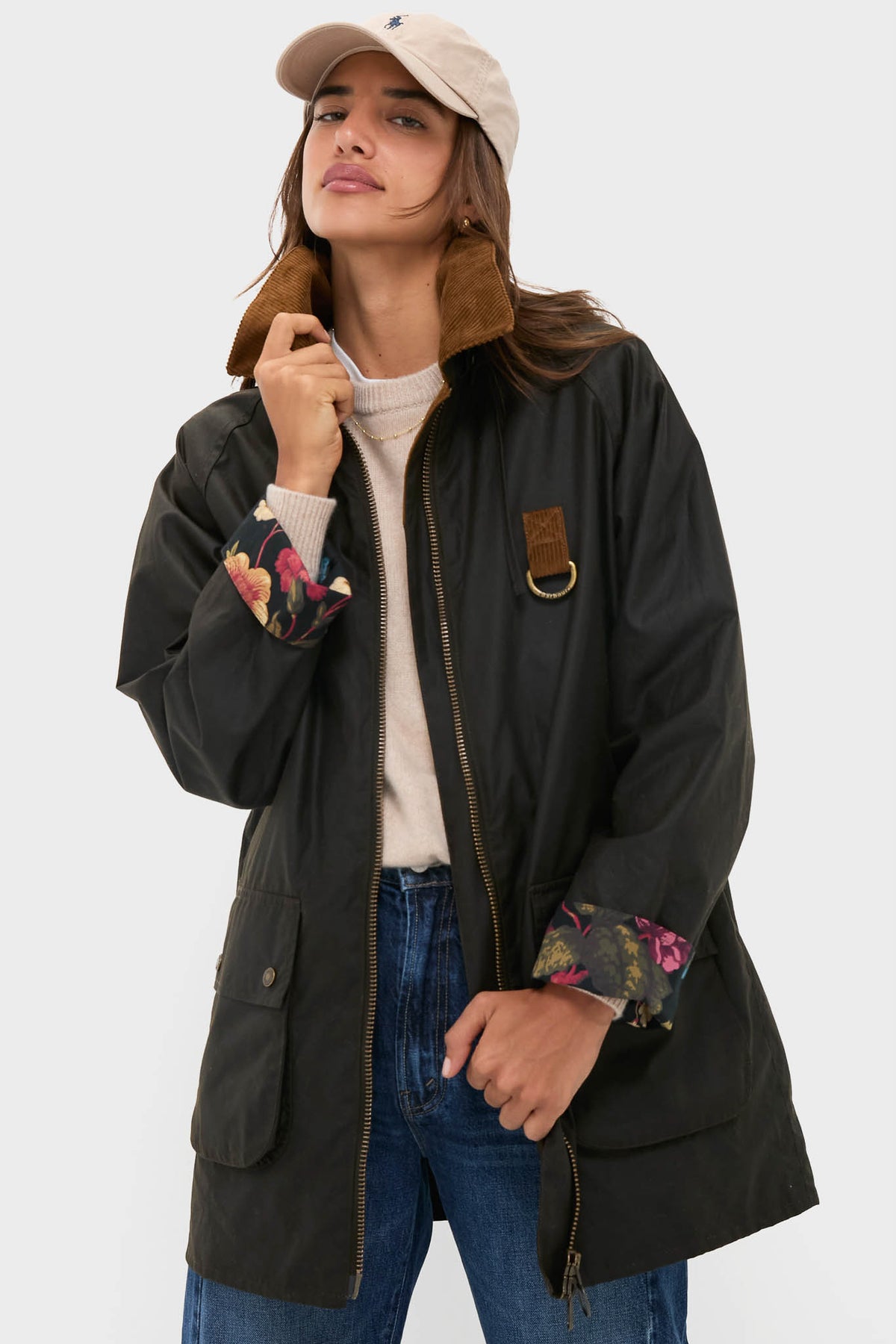 A woman wearing a Barbour x Tuckernuck black jacket.