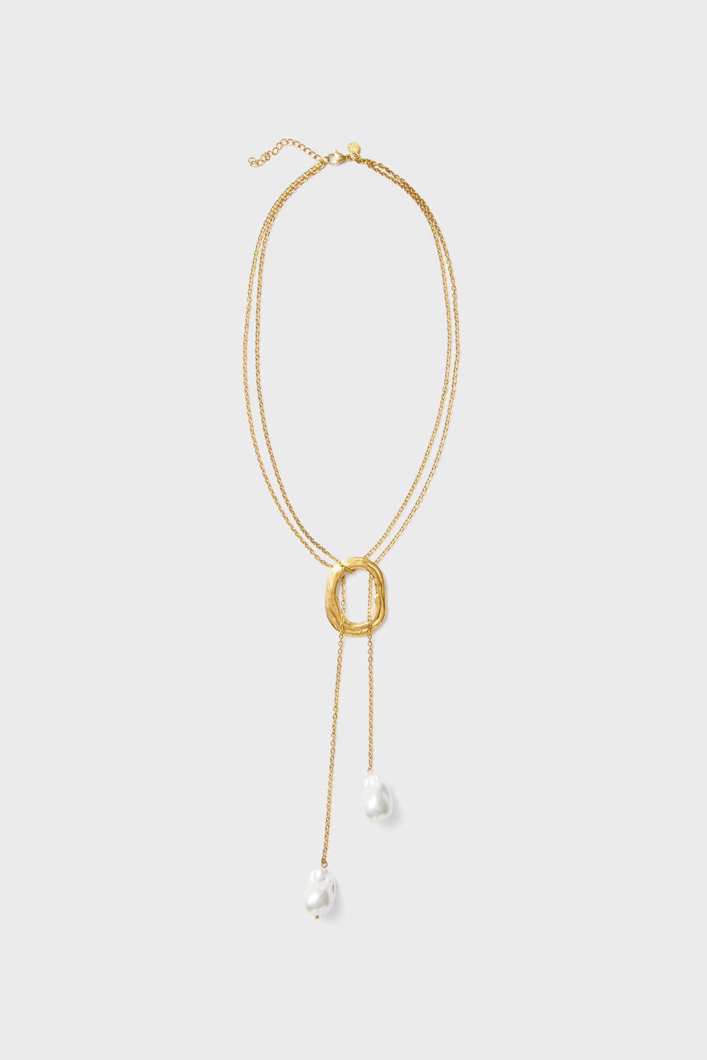 Petit Moments Gold Solar Necklace features a double strand design with a statement pendant and two dangling white pearl-like beads, perfect for elevating any look.