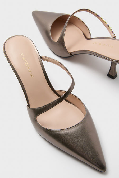 Gunmetal Leather Mimi Heels: Classic slip-on mules with pointed toes, effortless diagonal arch strap, and fun kitten heels, embodying Tuckernuck's high-end style.