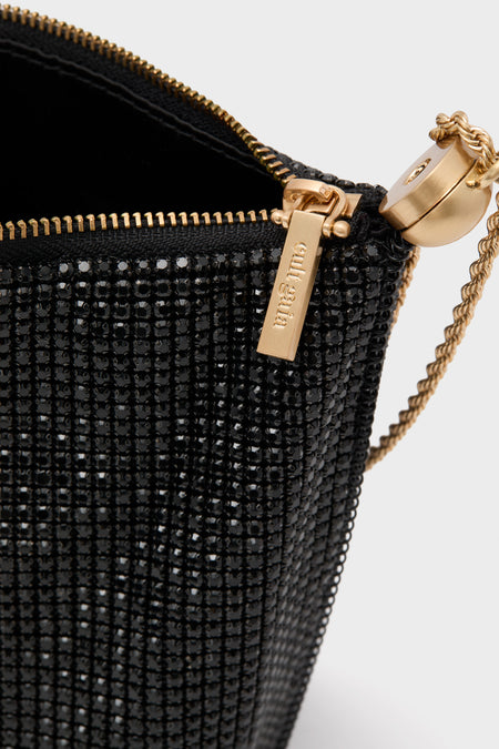 Cult Gaia Black Rue Wristlet, adorned with black beads and gold detailing, exudes classic elegance and effortless glamour, perfect for high-end evening events.