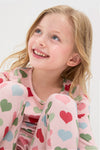Young girl in a Pink Small Hearts Kids Bamboo Pj Set, showcasing a classic, effortless, and fun bedtime look with a high-end, cozy bamboo fabric.