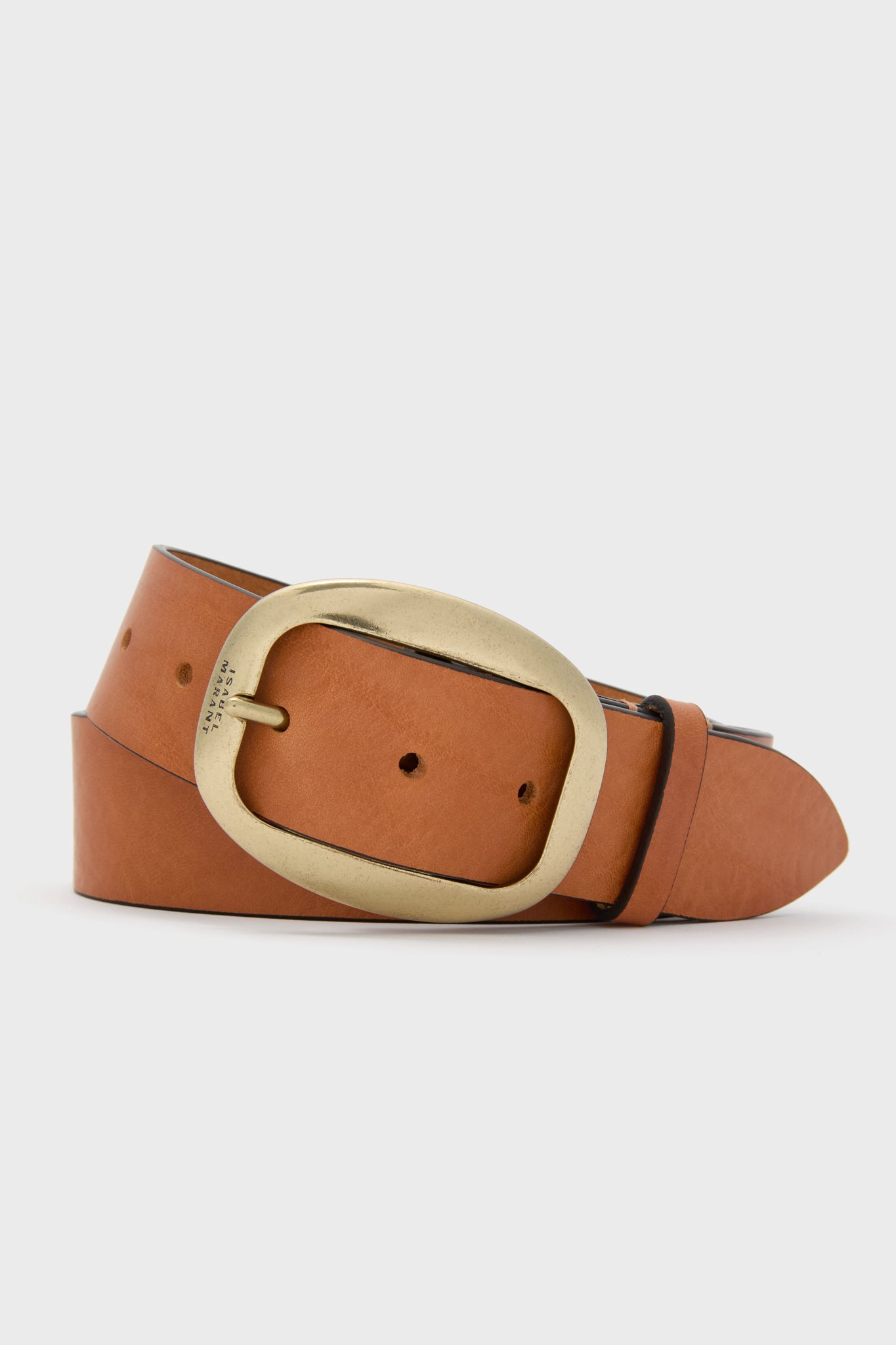 The Isabel Marant Cognac Dara Buckle Belt features brown calfskin leather and a large, rounded brass buckle elegantly coiled.