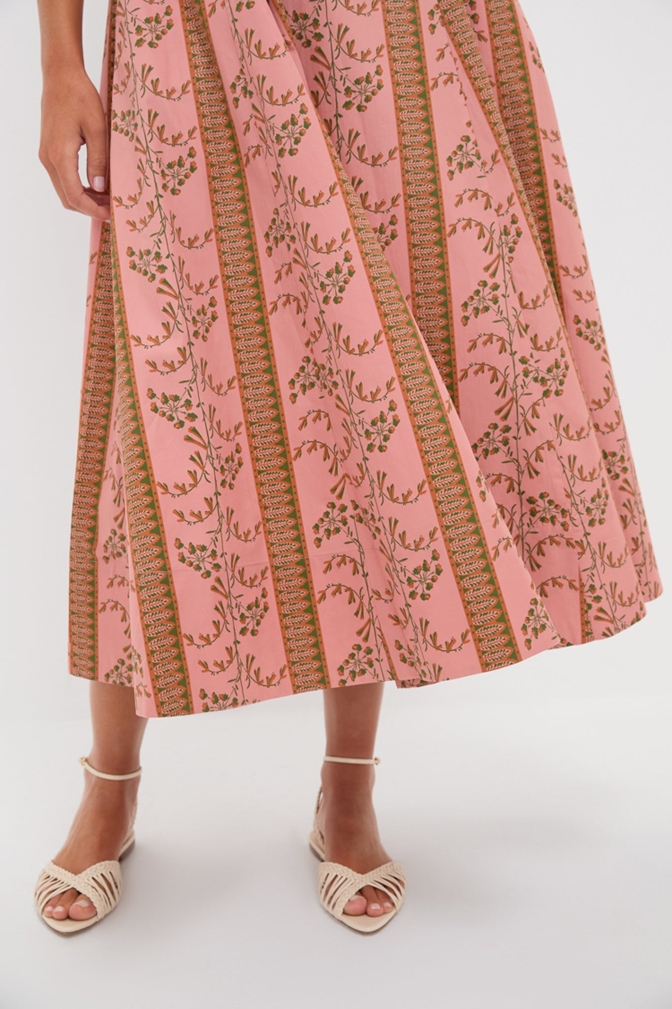 Rust Dandelion Floral Stripe Maisie Dress features classic A-line design, effortlessly fun floral bands, paired with high-end woven sandals for a confident, chic look.