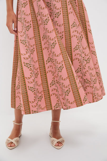 Rust Dandelion Floral Stripe Maisie Dress features classic A-line design, effortlessly fun floral bands, paired with high-end woven sandals for a confident, chic look.