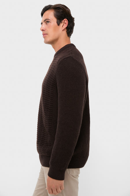 Young man wearing the classic Dark Oak Cleveland Crew Neck Sweater, showcasing its knit texture and relaxed fit, effortlessly embodying Tuckernuck's fun, high-end style.