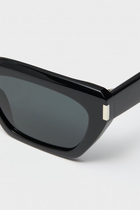 Shiny Solid Black Corner Angle M Sunglasses with a chunky cat-eye frame, silver hinge accents, and dark lenses, embodying a classic and effortless high-end style.