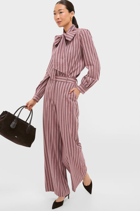 Mauve Stripe Brianna Bow Blouse styled with matching trousers; an effortlessly chic, classic look accented by a dramatic bow tie, embodying Tuckernuck's fun, high-end fashion ethos.
