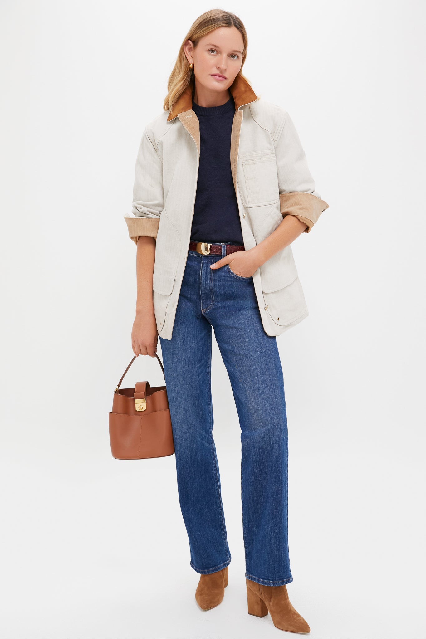 Woman wearing classic Kindred Spirit Mid-High Rise 90's Straight jeans with a high waist and clean hem, styled effortlessly with a chore jacket and suede ankle boots.