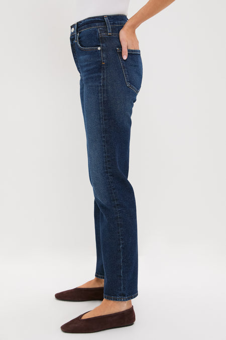 Sutherland Blaine Jean: Classic high-rise, straight-leg denim with a vintage-inspired look, paired effortlessly with a white top and brown flats for a high-end, fun style.