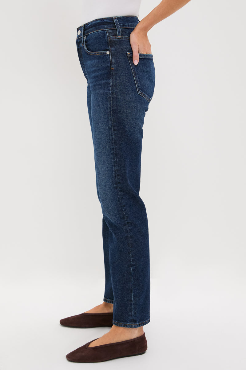 Sutherland Blaine Jean: Classic high-rise, straight-leg denim with a vintage-inspired look, paired effortlessly with a white top and brown flats for a high-end, fun style.