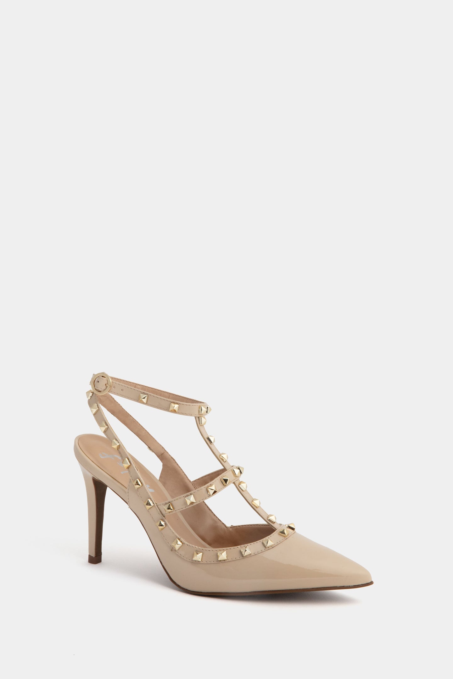 French Sole beige patent leather stiletto heels with a pointed toe, ankle strap, and double straps embellished with gold pyramid studs.