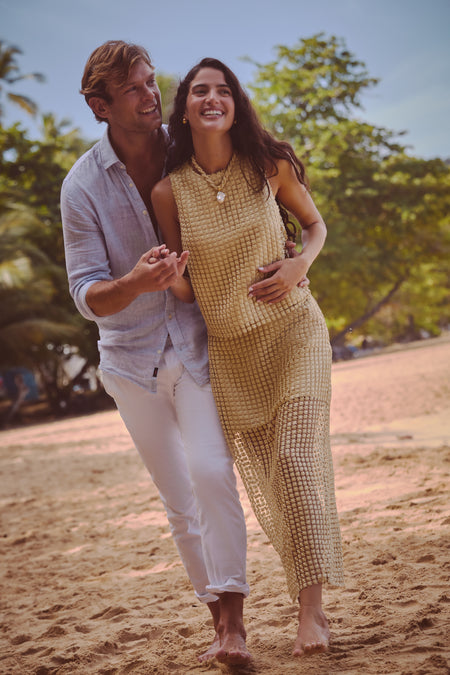 Young couple enjoying a beach stroll, embodying an effortless, high-end vibe with the Sandbar Woven Collar, exuding classic style and fun, beach-ready sophistication.