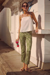 Young woman in Cowrie Block Print Ashford Pants, showcasing a classic, effortless style with a high-end, fun botanical pattern, embodying a laid-back, summery vibe.