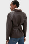 Effortlessly stylish, the Reversible Marron Fur Coat features a classic faux leather design with a plush collar and self-tie belt, epitomizing high-end sophistication.