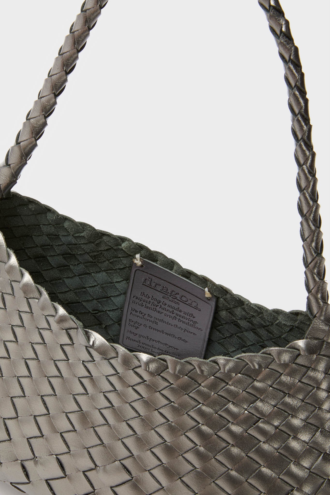 Covert Foil Rosanna Mini Croce: A classic woven leather tote with braided straps and open top, offering effortless day-to-night style. High-end craftsmanship for fun, versatile use.