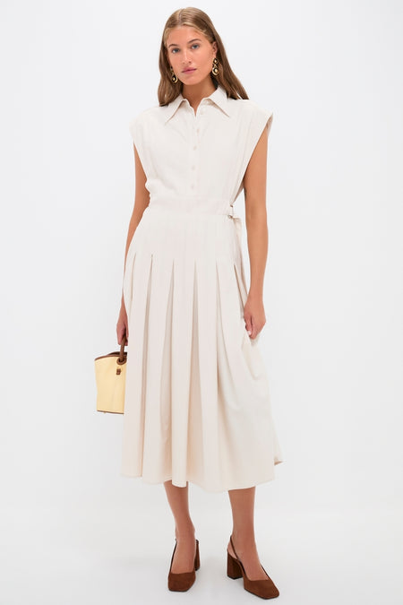 Model in a sleeveless cream-beige midi dress pairs with classic, high-end Pecan Brown Leia Block Sling Back Heels, showcasing an effortless, fun, and structured style.