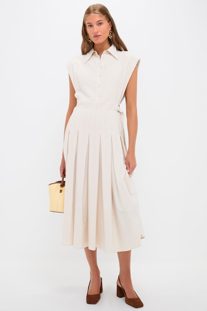 Model in a sleeveless cream-beige midi dress pairs with classic, high-end Pecan Brown Leia Block Sling Back Heels, showcasing an effortless, fun, and structured style.