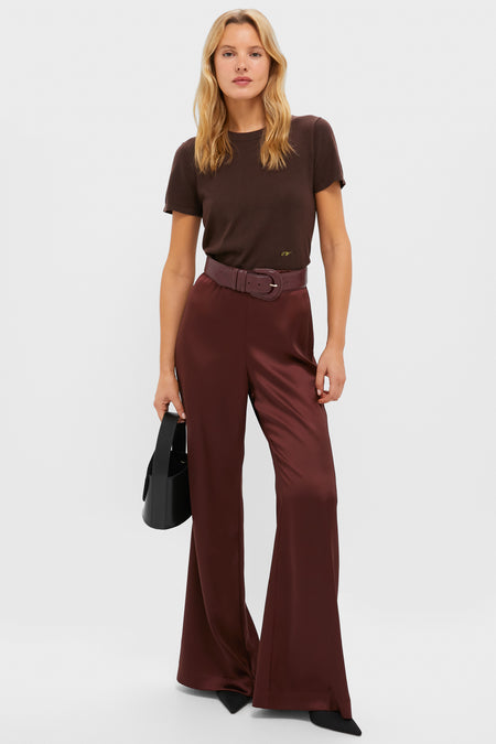 Model showcasing the Oxblood Croc-Embossed Waist Belt, cinching burgundy satin trousers, epitomizing an effortless, high-end style with classic elegance and fun flair.