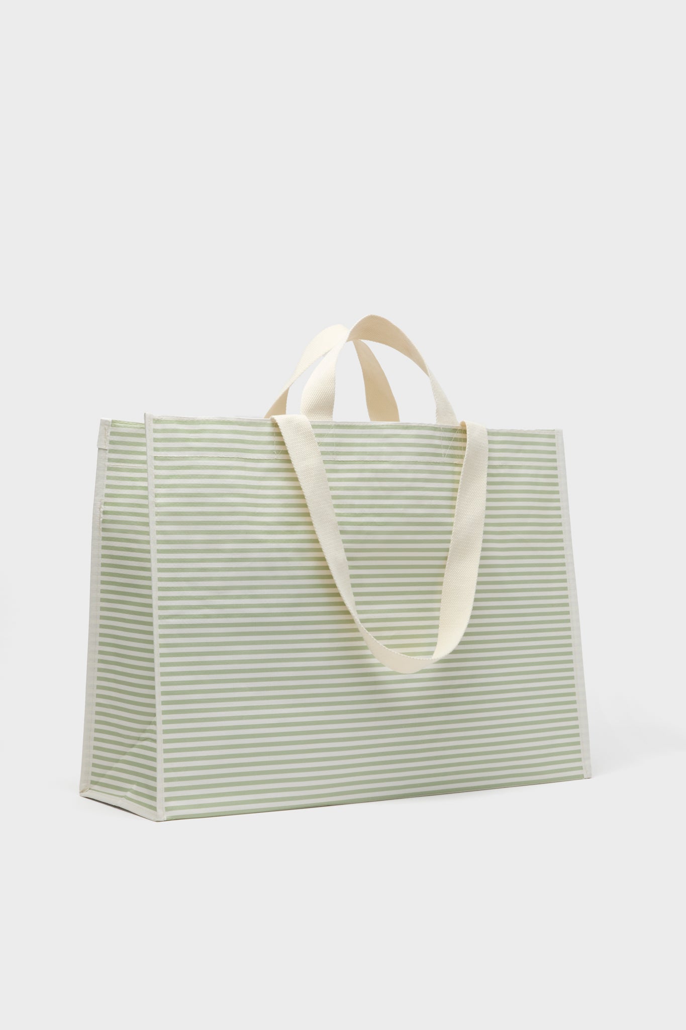 Sunnylifes rectangular beach bag features light green and white horizontal stripes, two cream-colored handles, a structured shape, and waterproof material—ideal for sunny days by the sea.