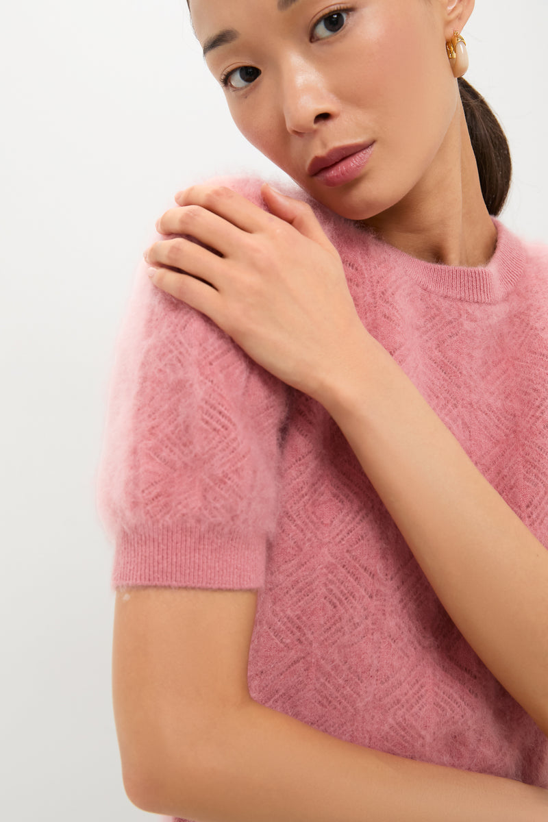 Woman wearing the classic Dusty Rose Brushed Merino Wool Puff Sleeve Lexie Sweater, showcasing its soft texture and effortless style with a fun, high-end look.