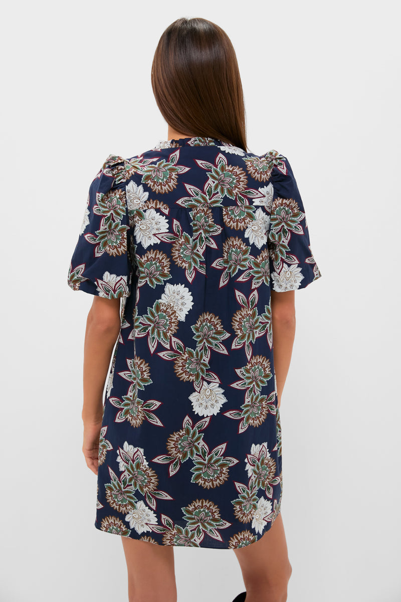 Navy Floral Mimi Mini Dress featuring classic puff sleeves and a gathered yoke, embodying effortless, high-end style with a fun, botanical pattern.