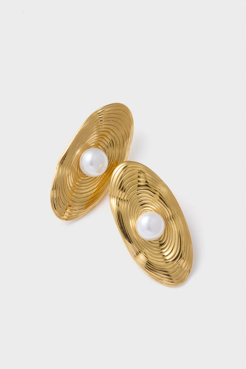 Gold Trumbull Earrings with concentric rippled gold-tone grooves and centered faux-pearl, blending classic elegance with a modern twist for an effortless, fun, high-end look.