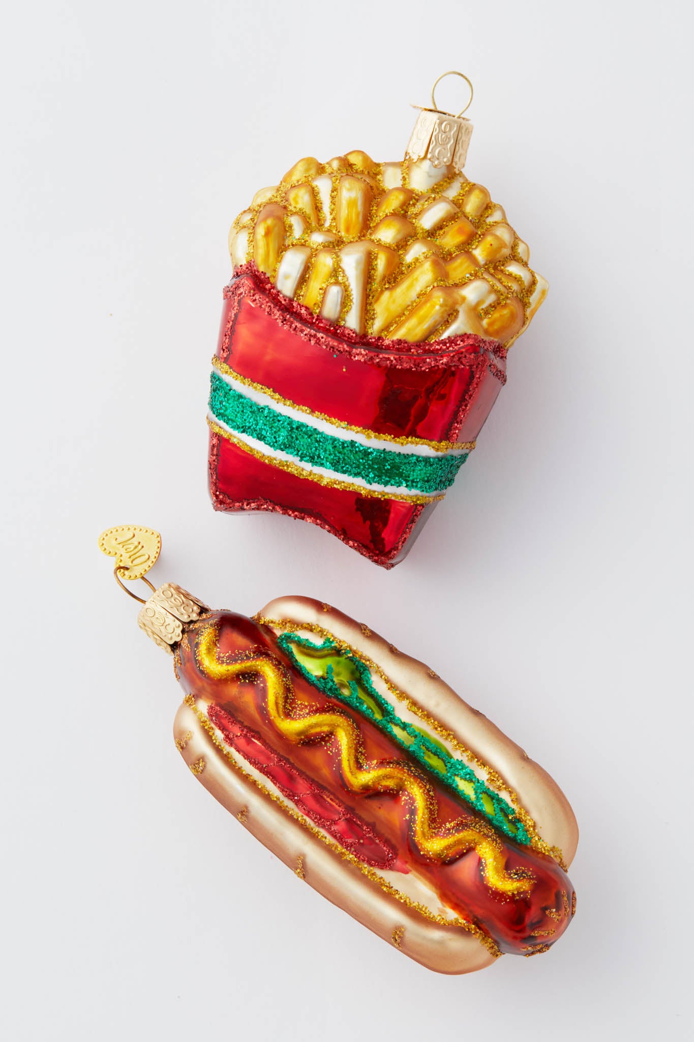Hot Dog Ornament: A classic, fun, high-end glass Christmas ornament, hand-painted, glittered, featuring a hot dog with toppings, effortlessly embodying American nostalgia and holiday cheer.