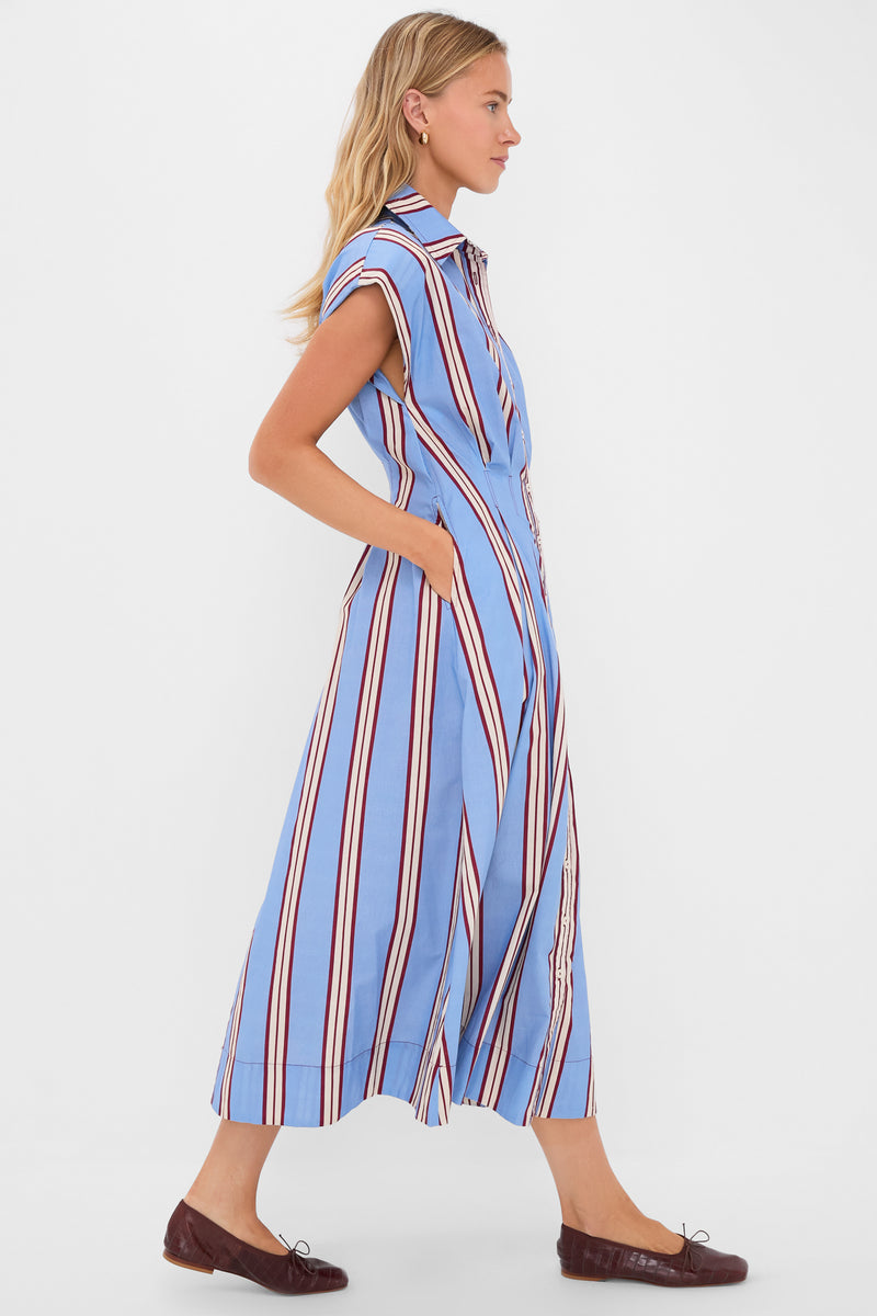 Classic Striped Mirante Shirt Dress modeled in profile, featuring effortless vertical stripes, button front, and side pockets. Paired with simple ballet flats for a fun, high-end look.