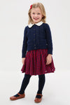 Preschool girl in a classic, effortless Red Blue Check Gianna Skirt, featuring a fun ruffle trim and elastic waist, embodying high-end style and playful elegance.