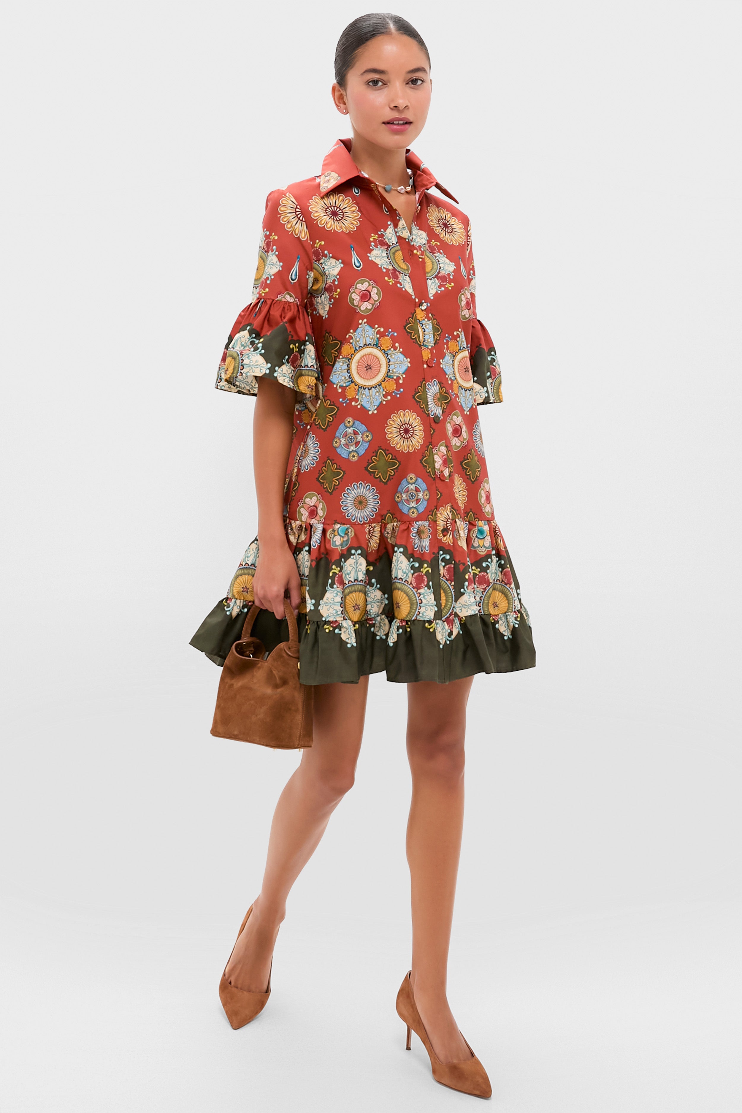 A woman in a vibrant red dress from La DoubleJ.