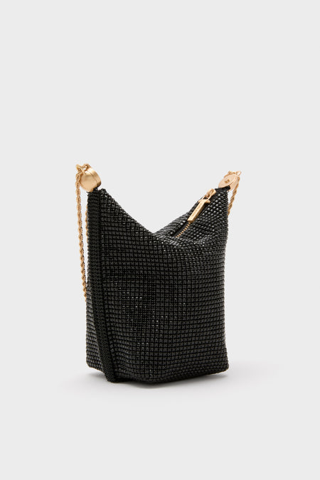 Classic Black Rue Wristlet minaudière, effortlessly glamorous with black crystal-mesh, gold-tone zipper, and chain strap. Perfect for fun, high-end evening events.