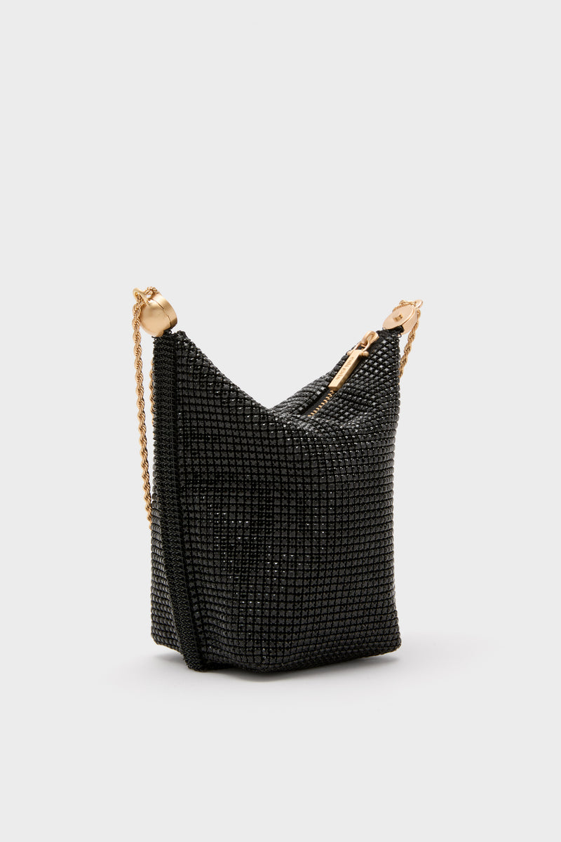 Classic Black Rue Wristlet minaudière, effortlessly glamorous with black crystal-mesh, gold-tone zipper, and chain strap. Perfect for fun, high-end evening events.