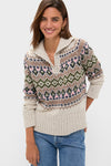 Woman in a classic, high-end Eggshell Fair Isle Edna Sweater with a relaxed fit and ribbed polo collar, paired with jeans, exuding effortless, fun style.