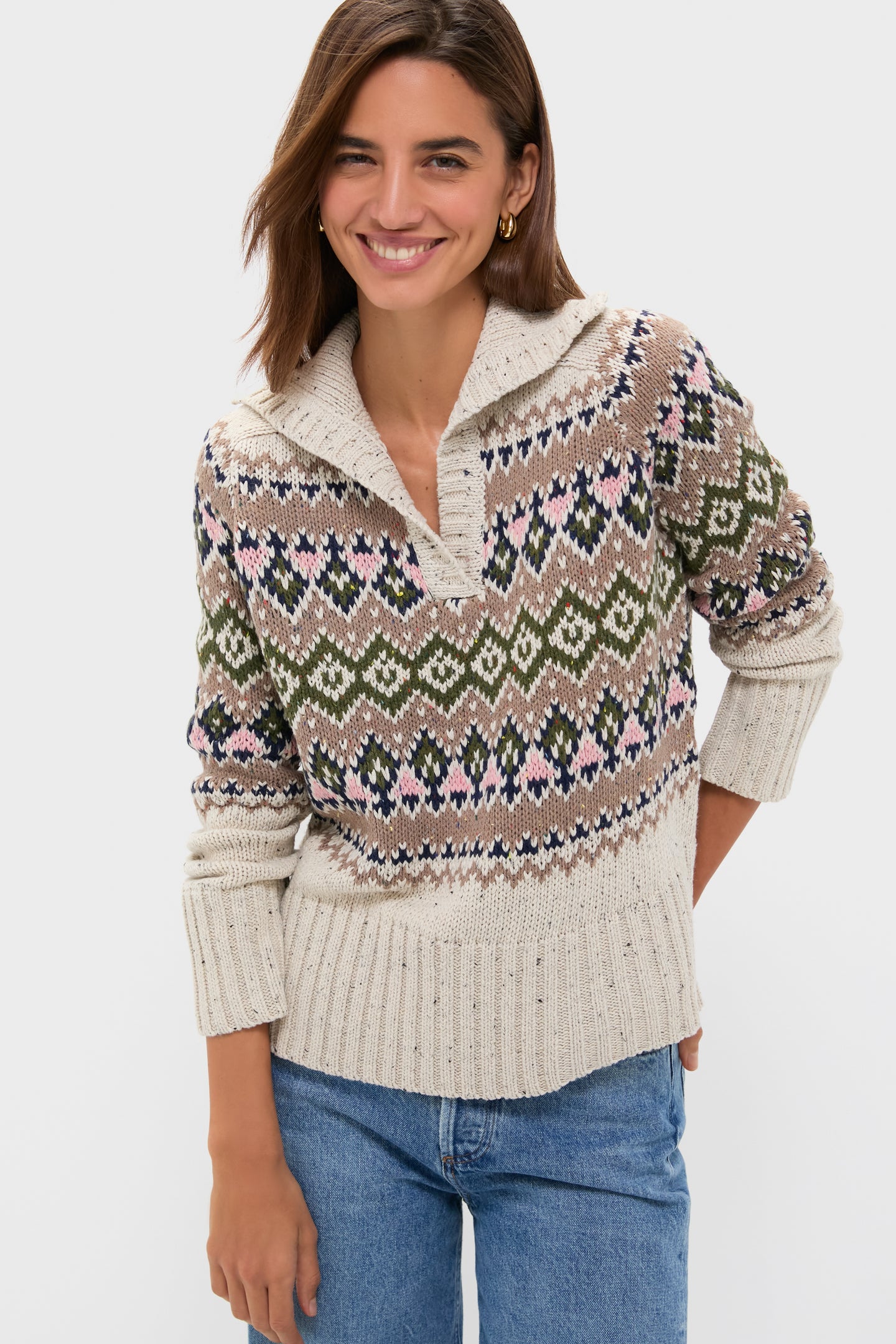 Woman in a classic, high-end Eggshell Fair Isle Edna Sweater with a relaxed fit and ribbed polo collar, paired with jeans, exuding effortless, fun style.