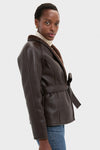 Reversible Marron Fur Coat: A classic, high-end faux leather jacket with a self-tie belt, shearling lining, effortlessly styled with a sweater and jeans for a fun, sophisticated look.
